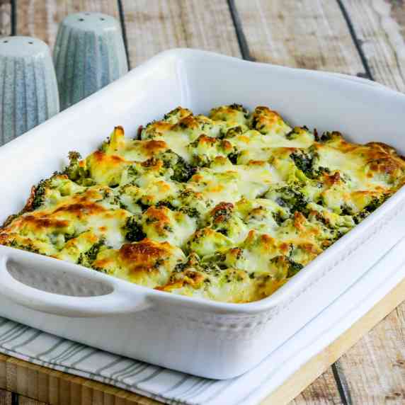 Broccoli Cauliflower Rice Casserole shown in baking dish with melted cheese.