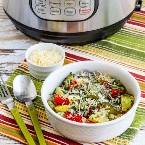 Instant Pot Ratatouille shown in serving bowl with Instant Pot in background.