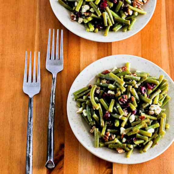 Thanksgiving Green Bean Salad shown on two plates with forks.