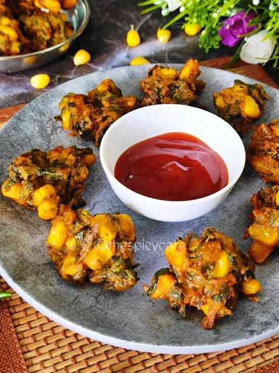 A crispy addictive snack recipe made with spinach and boiled corns along with spices & herbs.