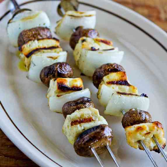 Grilled Halloumi Cheese on skewers with mushrooms and onions.