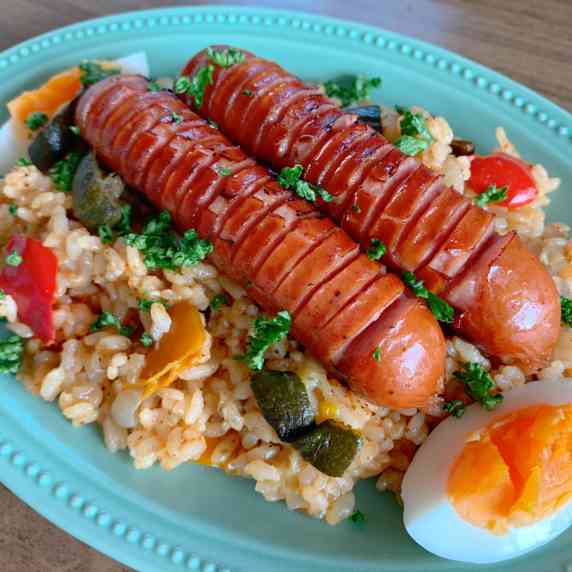 Jambalaya is rice seasoned with Cajun spices. Topped with Johnsonville sausages.
