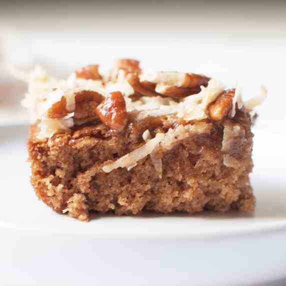 A slice of Amish cake (oatmeal cake with coconut and pecan topping)