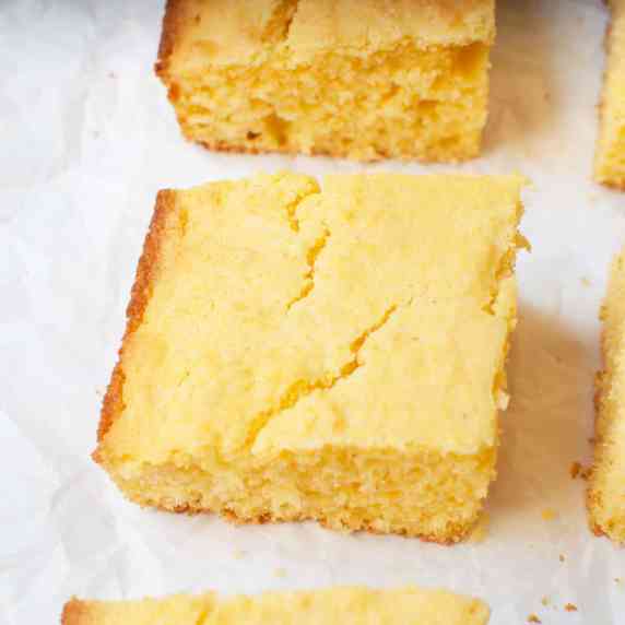 A photo of cornbread slices on a white background