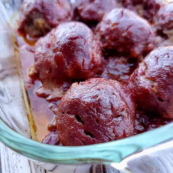 Meatballs in a glass baking dish.