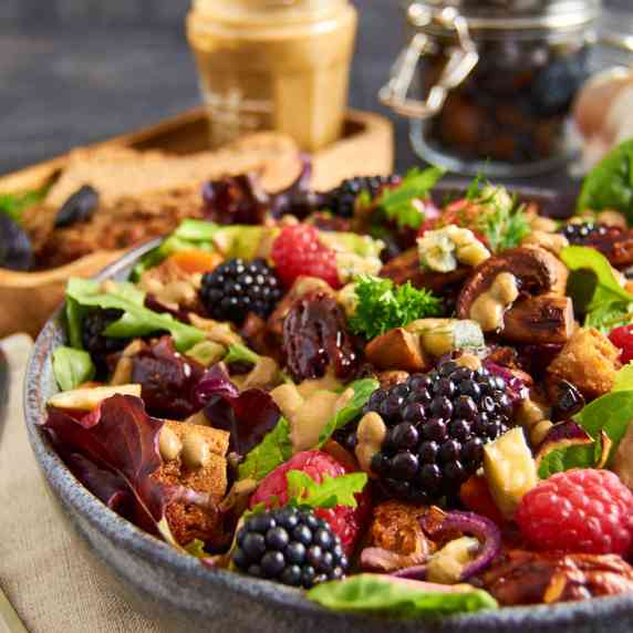 Salad with Roasted Mushrooms, berries, blue cheese, croutons and candied pecans