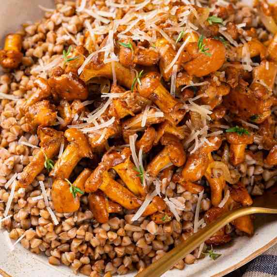 Cooked buckwheat topped with caramelized chanterelle mushrooms