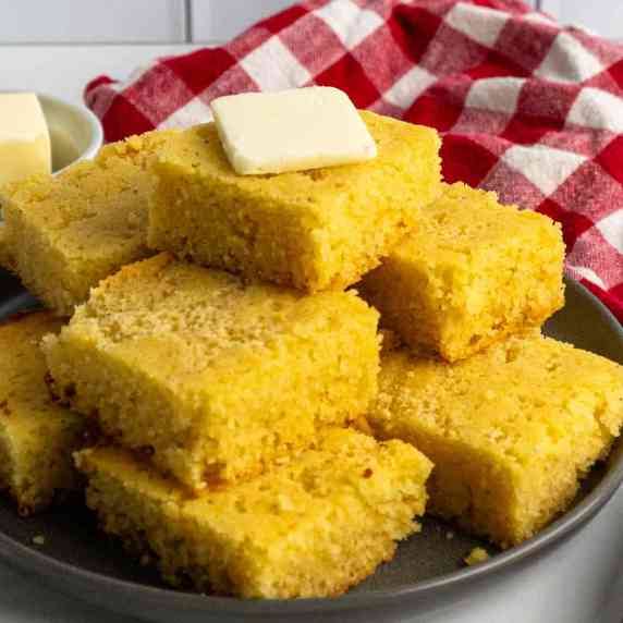 Cornbread stacked on top of each other.