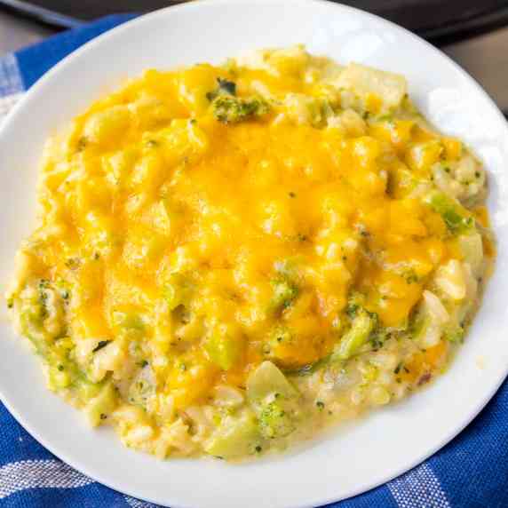 broccoli rice casserole topped with cheddar cheese