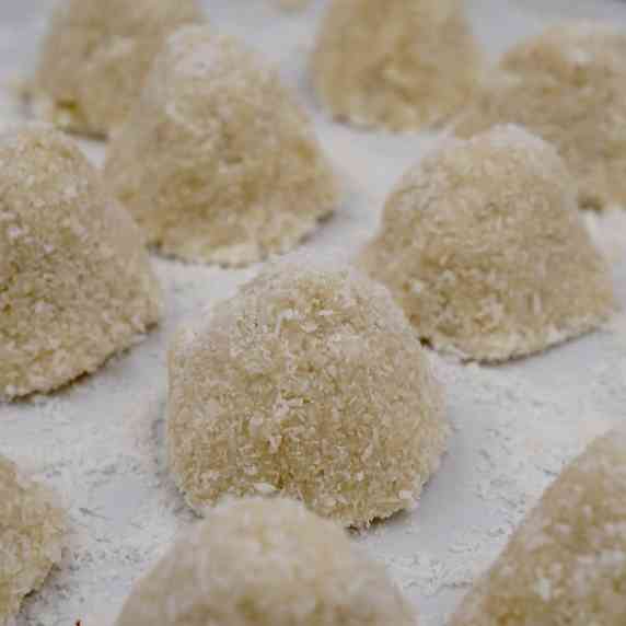 Close up view of a plate of white chocolate truffles