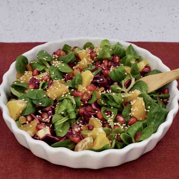 A bowl of winter salad made with colourful ingredients