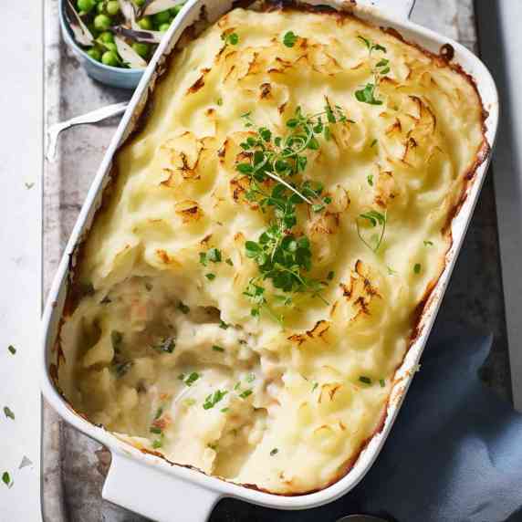 Creamy fish pie topped with buttery fluffy mashed potatoes.
