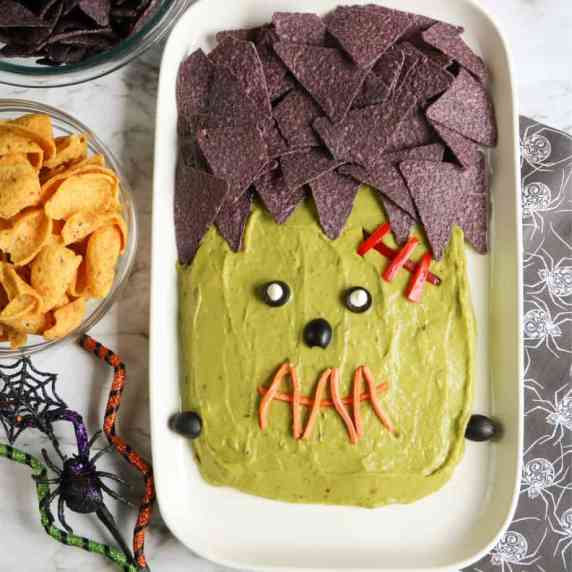 Close up of guacamole platter decorated like the monster Frankenstein.