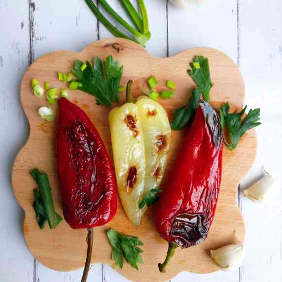 Three whole grilled sweet peppers.
