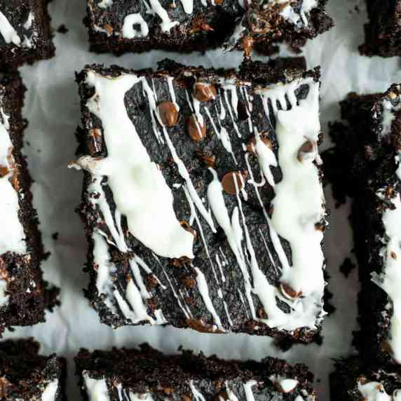 Healthy pumpkin brownies drizzled with white chocolate. 