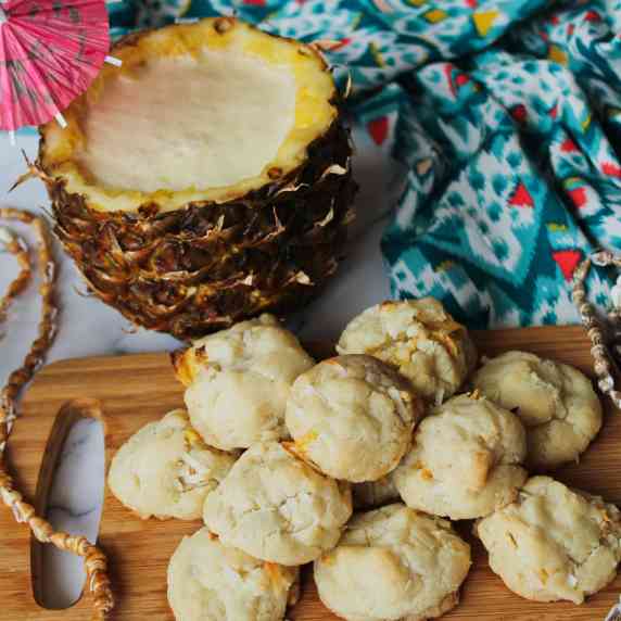 Tray of cookies with pina colada served in a pineapple