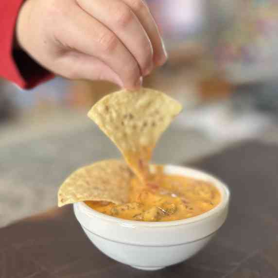 Delicious queso with chorizo sausage and chips!