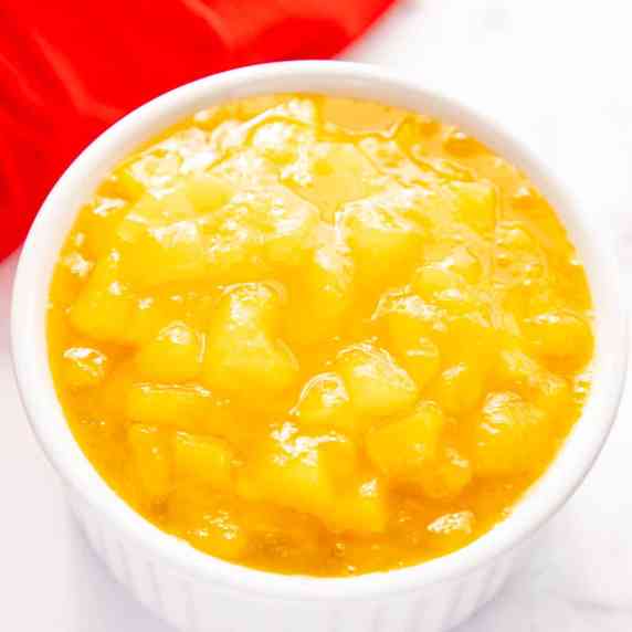 mango compote in a white bowl