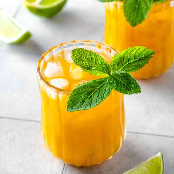 Two glasses with mango mule mocktail