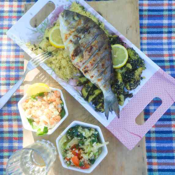 Grilled whole fish with prawn coctain and fresh salad.