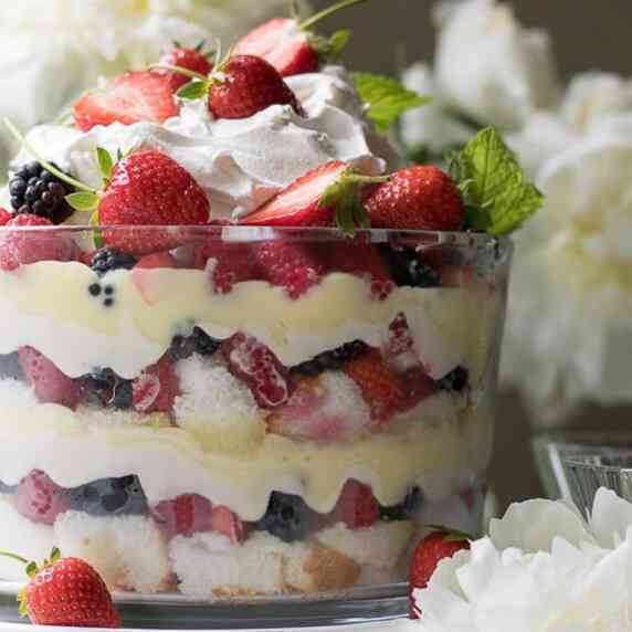 This mixed summer berry trifle is a delightful, show stopping dessert. Two layers of angel food cake