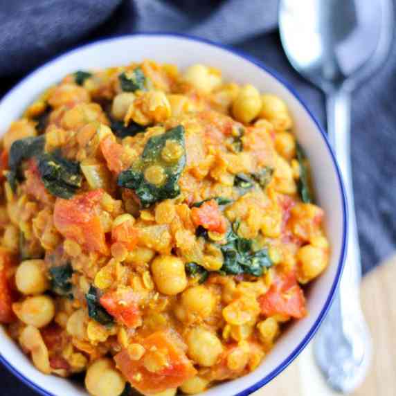 Chickpea curry in a white bowl.