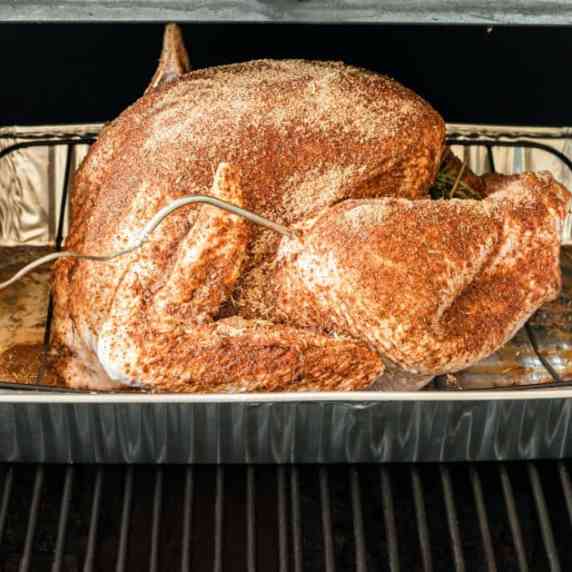 Close up of a turkey on a pellet grill.