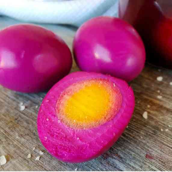 Brightly colored, pickled red beet eggs.