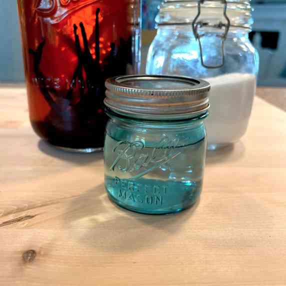 Vanilla Simple Syrup in blue mason jars