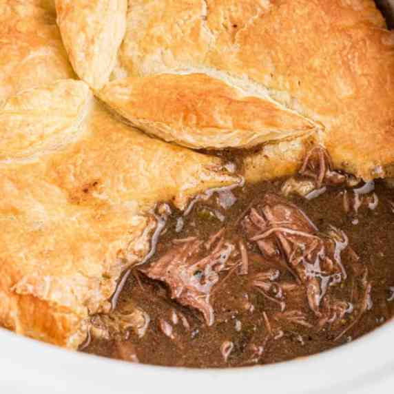 CLose up of a slow cooker steak pie.