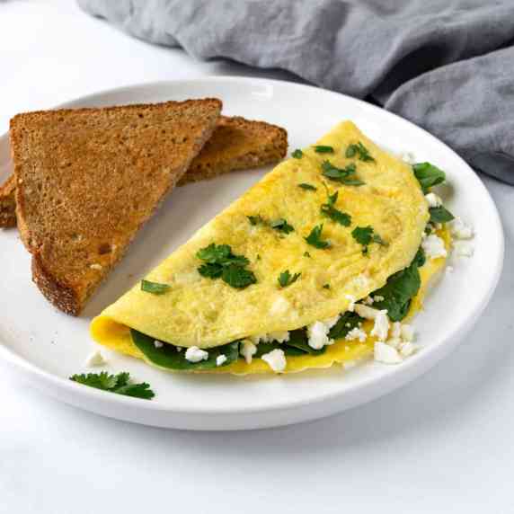 Spinach and Feta Omelet on a white plate.