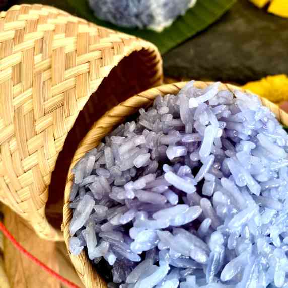 Thai purple sticky rice in a bamboo basket.