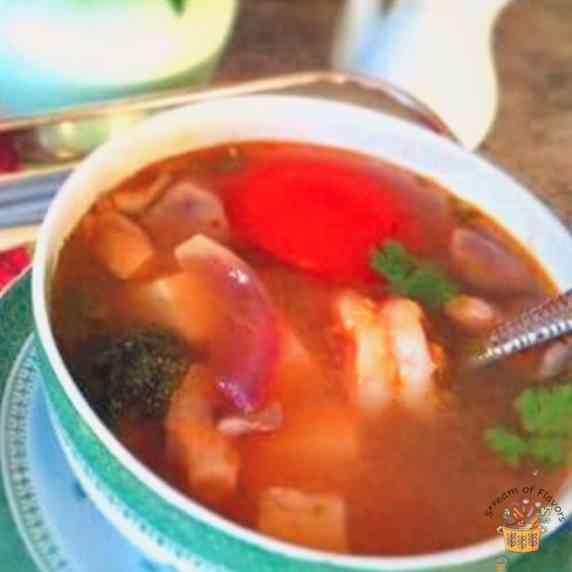 Tom Yum Goong Soup with tofu, shrimp, mushrooms, and vegetables