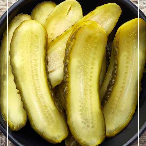 sliced sweet pickles in bowl