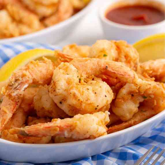 Serving platter with fried shrimp.