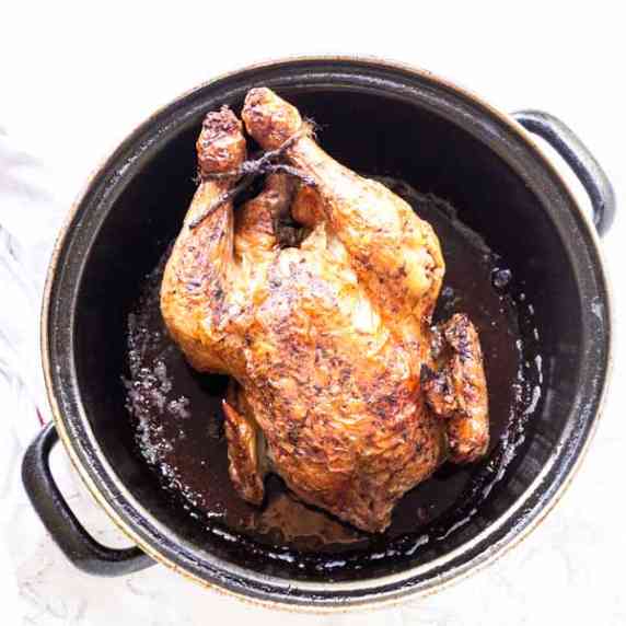 Whole roasted chicken in Dutch oven