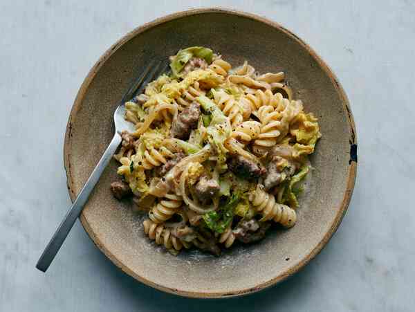 a bowl of Pasta With Sausage, Caramelized Cabbage and Goat Cheese