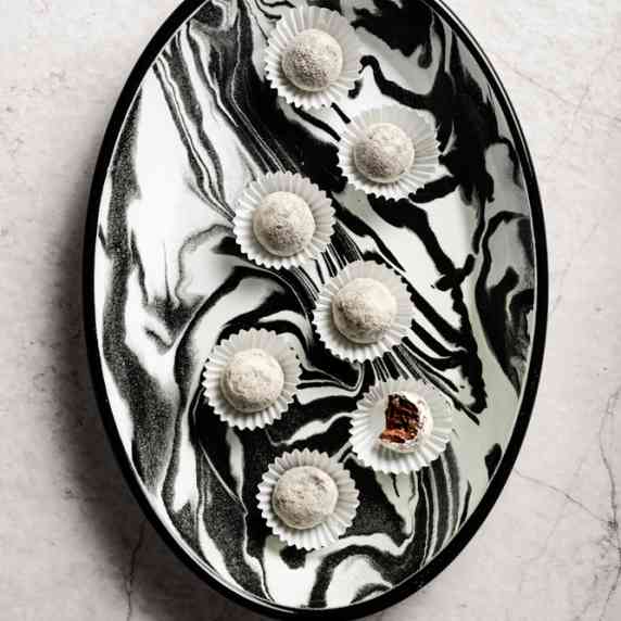 Baobab Truffles arranged in a white and black aesthetic bowl