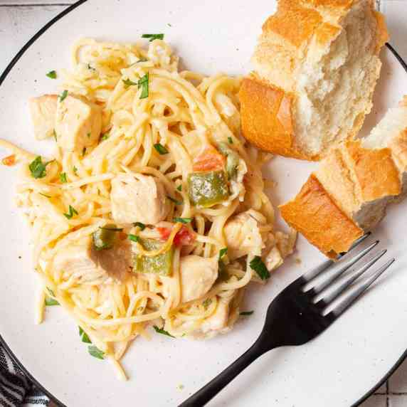 A three-cheese mixture with spaghetti noodles, chicken, and lots of flavorful components go into thi