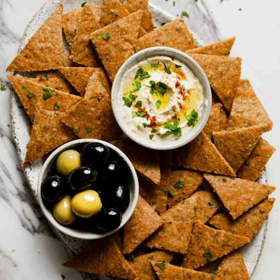Chickpea Chips arranged in an aesthetic bowl with dressings