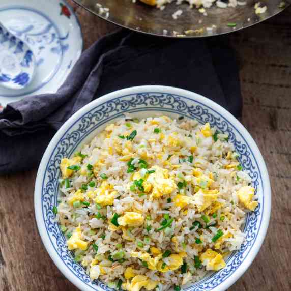 A bowl of simple Chinese egg fried rice in a bowl.