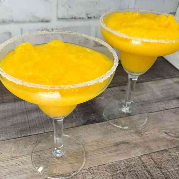 glasses of frozen mango margaritas