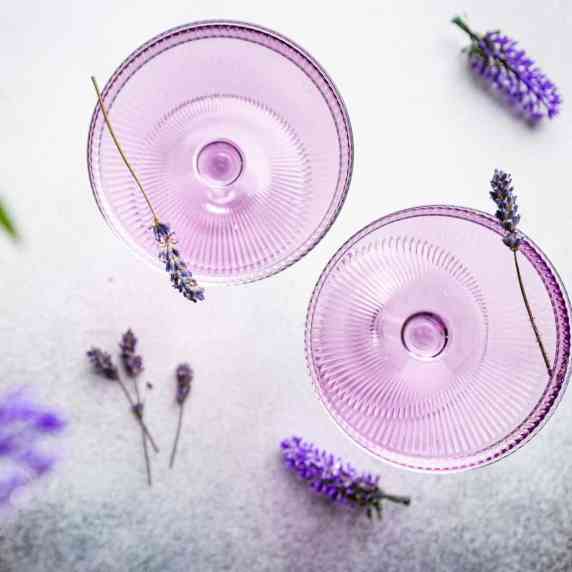 Purple cocktails garnished with lavender.