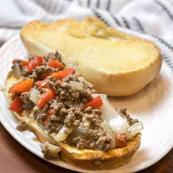 Philly cheesesteak on a plate.