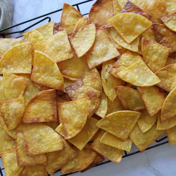Homemade tortilla chips on a cooling rack