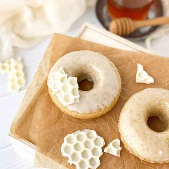 Honey Doughnuts on parchment paper with white chocolate 