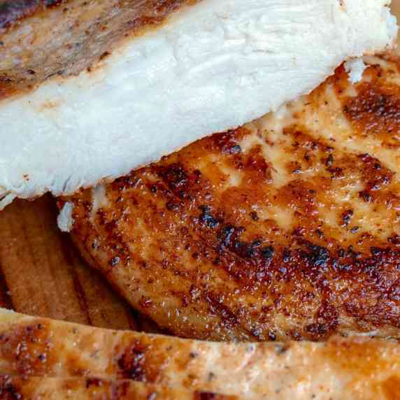 Perfectly cooked chicken breast, cut revealing the juicy center