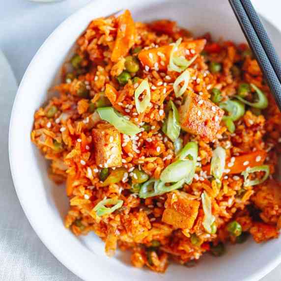 kimchi fried rice on a white bowl 