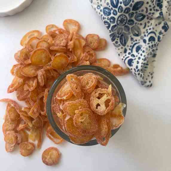 candied kumquats in a glass jar