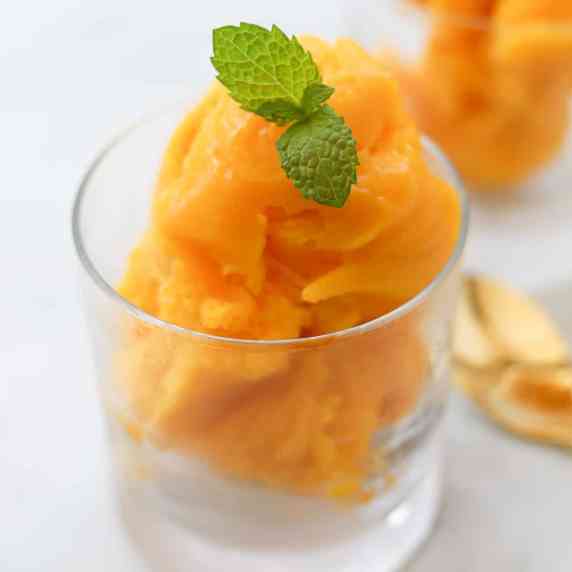 Mango sorbet in a cup.